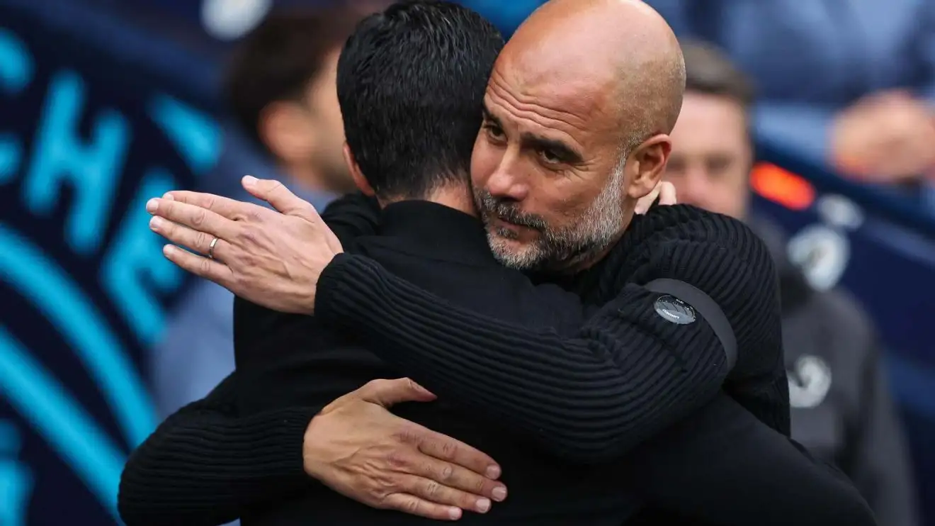 Pep Guardiola hugs Mikel Arteta